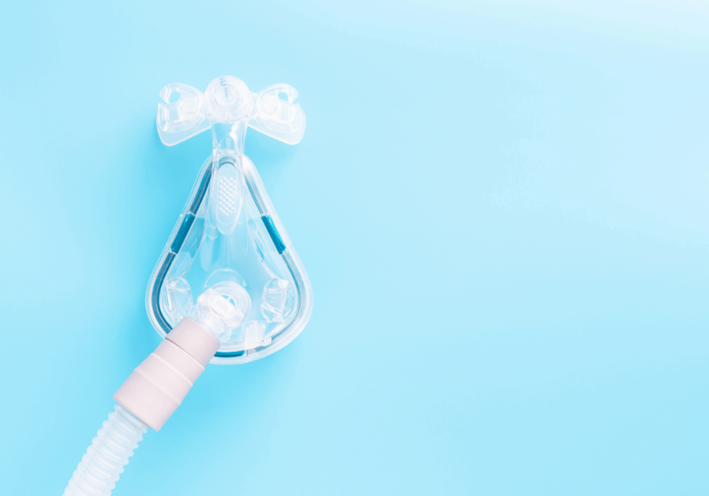 sleep apnea machine on a blue background